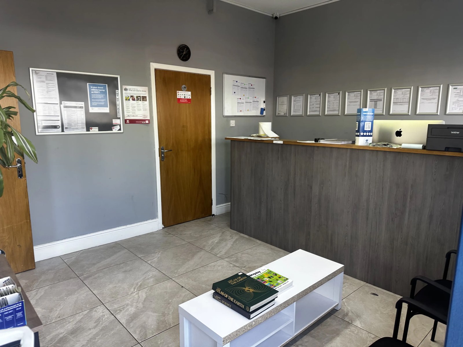 Surbiton Auto Services reception area with certifications on display